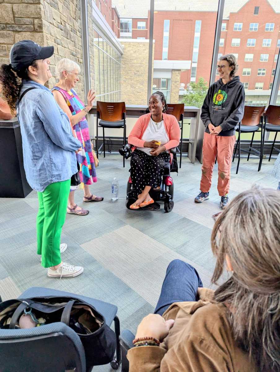 Sefakor Komabu-Pomeyie talks with some of her listeners at the discussion and reading for her book.