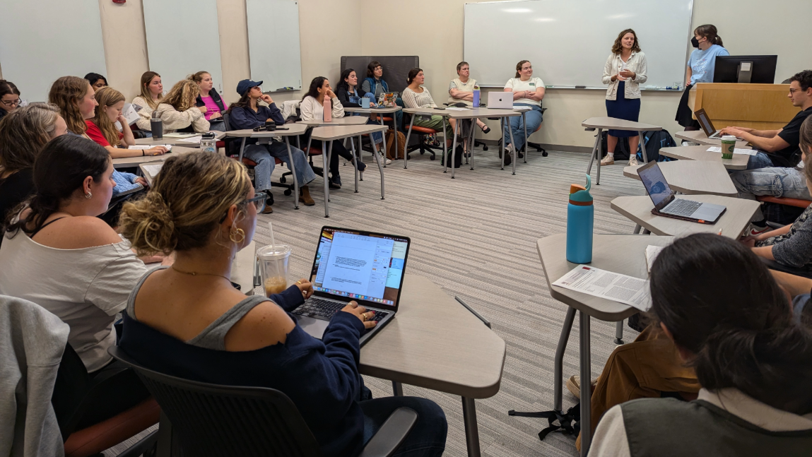 Packed classroom in Dana Health Sciences Library hosts professors and students to discusss a published paper