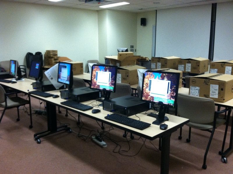 Setting up the new computers to be installed in classrooms.